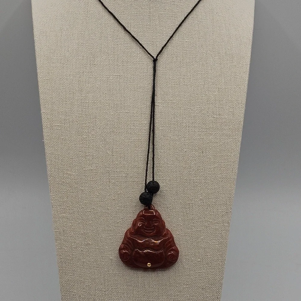 Carved Red Stone Laughing Buddha Pendant Black Cord Necklace Gold Tone Accent